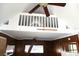 Charming living room with wood paneling and a unique loft space above, enhanced by a ceiling fan at 28127 Knowles Rd # Ab&C, Evergreen, CO 80439