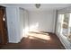 Spacious living room with a door to the exterior and big window offering great sunlight at 28127 Knowles Rd # Ab&C, Evergreen, CO 80439