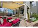 Comfortable backyard patio with shade covering and outdoor seating at 2521 N Xenia St, Denver, CO 80238