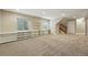 Finished basement with built-in shelving and carpeted flooring at 2521 N Xenia St, Denver, CO 80238