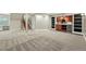 Finished basement with carpet flooring, bar area, and staircase at 2521 N Xenia St, Denver, CO 80238