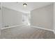 This bright bedroom features a neutral palette, carpeted floor, and double windows at 2521 N Xenia St, Denver, CO 80238