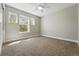 Bright bedroom with three windows, carpeted floor, creating a relaxing atmosphere at 2521 N Xenia St, Denver, CO 80238