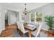 Elegant dining room with hardwood floors, decorative chandelier, and plenty of natural light at 2521 N Xenia St, Denver, CO 80238