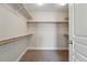 Spacious walk-in closet with multiple shelves and rods for organization and storage at 2521 N Xenia St, Denver, CO 80238