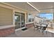 Comfortable back porch area featuring tables and chairs for outdoor dining and relaxing at 2775 S Jebel Way, Aurora, CO 80013