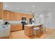 Well-equipped kitchen with wooden cabinetry, a center island, and modern appliances at 2775 S Jebel Way, Aurora, CO 80013