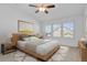 Comfortable bedroom featuring vaulted ceilings, neutral tones, and three large windows at 2775 S Jebel Way, Aurora, CO 80013