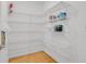 Walk-in pantry with wood floor and wire shelving for ample storage space at 2775 S Jebel Way, Aurora, CO 80013
