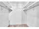 This walk-in closet is equipped with shelves and rods, offering ample storage at 800 N Pearl St # 303, Denver, CO 80203
