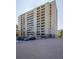 Exterior shot of the condo building with adjacent tennis court and parking at 800 N Pearl St # 303, Denver, CO 80203
