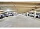 A look at the expansive indoor parking garage with plentiful parking spaces and bright overhead lighting at 800 N Pearl St # 303, Denver, CO 80203