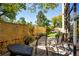 Charming patio with outdoor seating, a brick wall, and lush greenery, perfect for relaxation and entertaining at 800 N Pearl St # 303, Denver, CO 80203