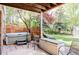 Enjoy this backyard patio area with a hot tub, lounge chairs, and a privacy fence at 9867 W Berry Dr, Littleton, CO 80123