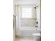 Bright bathroom featuring a tub with tile surround, shower, and vanity with stylish fixtures at 9867 W Berry Dr, Littleton, CO 80123