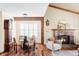Cozy living room with fireplace, hardwood floors, and comfortable seating at 9867 W Berry Dr, Littleton, CO 80123