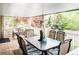 Outdoor patio featuring an overhead heater, glass table and comfortable seating, perfect for entertaining at 9867 W Berry Dr, Littleton, CO 80123