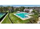 Aerial view of the community pool with diving boards and tennis courts nearby, ideal for recreation at 9867 W Berry Dr, Littleton, CO 80123