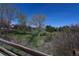 Picturesque stream flowing through lush greenery, enhancing the natural beauty of the community at 9867 W Berry Dr, Littleton, CO 80123