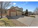 Lovely two-story home featuring a spacious three-car garage and well-maintained lawn, perfect for families at 15844 E Lake Cir, Centennial, CO 80016