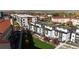 Scenic aerial view of contemporary townhomes with a central park and city skyline in the distance at 2900 W Parkside Pl, Denver, CO 80221
