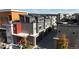 Aerial perspective of contemporary townhouses, each with rooftop decks and attached garages at 2900 W Parkside Pl, Denver, CO 80221