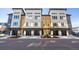 Exterior view of modern townhome community with garages at 2900 W Parkside Pl, Denver, CO 80221