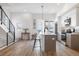 Modern kitchen with stainless steel appliances, center island, and hardwood floors throughout at 2900 W Parkside Pl, Denver, CO 80221