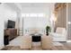 Inviting living room showcasing hardwood floors, a comfy sofa, and a decorative accent wall at 2900 W Parkside Pl, Denver, CO 80221