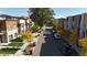 Street view of modern townhomes with landscaped sidewalks and on-street parking at 2900 W Parkside Pl, Denver, CO 80221