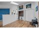 Open living area featuring hardwood floors, a skylight, and stylish furnishings at 17118 E Whitaker Dr # E, Aurora, CO 80015
