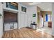 Inviting space with hardwood floors, adjacent kitchen, and modern decor at 17118 E Whitaker Dr # E, Aurora, CO 80015