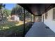Wide backyard view showcasing the covered patio, storage shed, and spacious green area at 5041 S Julian St, Englewood, CO 80110
