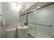 Updated bathroom featuring sleek shower, vanity, toilet and modern fixtures, offering a clean and comfortable space at 5041 S Julian St, Englewood, CO 80110