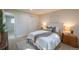 Bright bedroom features neutral colors, carpeted floors, and a comfortably styled bed at 5041 S Julian St, Englewood, CO 80110