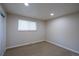 Neutral bedroom with plush carpet, white walls, and a large window, offering a blank slate to personalize at 5041 S Julian St, Englewood, CO 80110