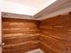 Cedar lined walk-in closet with metal rods for hanging storage at 5041 S Julian St, Englewood, CO 80110