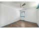 Well-lit bedroom with wood floors and a window with decorative bars at 12008 E Amherst Pl, Aurora, CO 80014