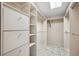 Large walk-in closet with built-in shelves and drawers at 12008 E Amherst Pl, Aurora, CO 80014
