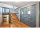 Inviting foyer with hardwood floors, staircase, and stylish double doors at 12008 E Amherst Pl, Aurora, CO 80014
