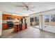 Well-appointed kitchen with an island, modern appliances, and a sliding glass door to the patio at 12008 E Amherst Pl, Aurora, CO 80014