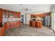 Gourmet kitchen featuring custom cabinetry, stainless steel appliances, and a functional island at 12008 E Amherst Pl, Aurora, CO 80014