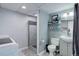 Functional bathroom with a shower, toilet, sink, and modern gray finishes at 12229 Circle Dr, Conifer, CO 80433