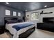 Bedroom with sleek, dark furnishings and a picturesque view from the bright window at 12229 Circle Dr, Conifer, CO 80433