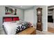A charming bedroom with a unique grandfather clock, patterned rug, and comfortable bedding at 12229 Circle Dr, Conifer, CO 80433