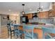 Modern kitchen featuring a granite countertop island with pendant lighting and stainless steel appliances at 12229 Circle Dr, Conifer, CO 80433