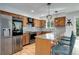 Well-equipped kitchen featuring stainless steel appliances, granite counters and hardwood flooring at 12229 Circle Dr, Conifer, CO 80433