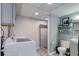 Functional laundry room with washer, dryer, a shower, and toilet at 12229 Circle Dr, Conifer, CO 80433