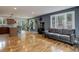Comfortable living room with hardwood floors, a fireplace, large windows, and stylish decor, offering a cozy feel at 12229 Circle Dr, Conifer, CO 80433