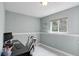 Bright office space with a large window and desk featuring light gray walls at 12229 Circle Dr, Conifer, CO 80433